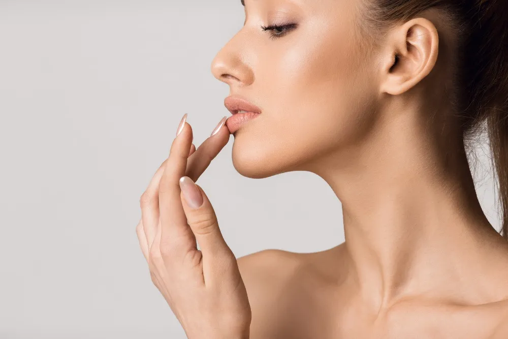 woman showing off longer lasting lip filler in Canton MI